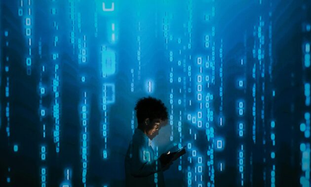 Silhouette of a person using a smartphone surrounded by digital binary code projections.